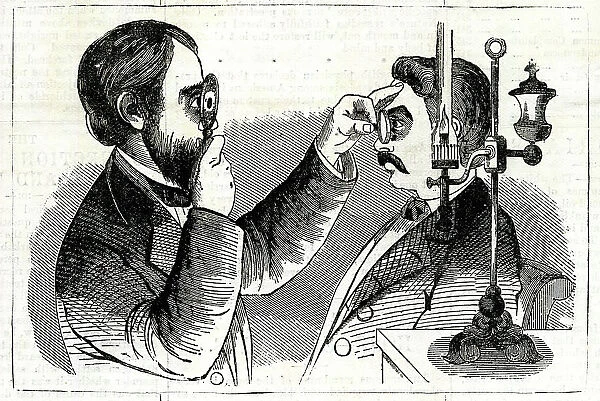 Optician examining a patient's eyes
