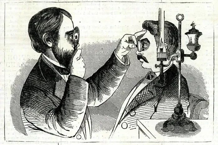 Framed Print : Optician examining a patient's eyes Framed Print : Optician examining a patient's eyes