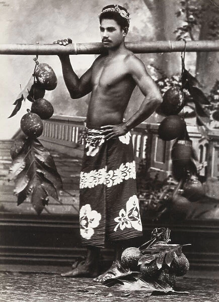 Pacific Islands, Oceania: portrait of a man carrying fruit