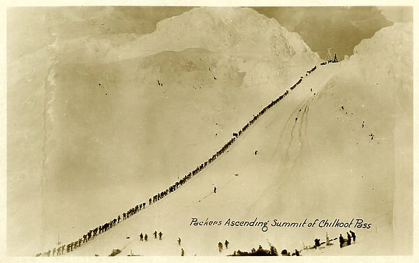 Packers ascending summit of Chilkoot Pass, Alaska, USA