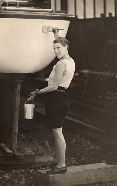 Painting a boat, 1933