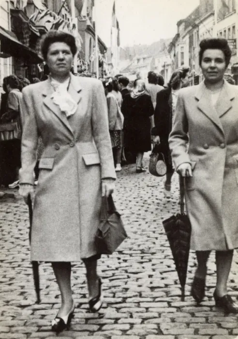 Framed Print : Pair of French twins strolling downing a cobbled street Framed Print : Pair of French twins strolling downing a cobbled street