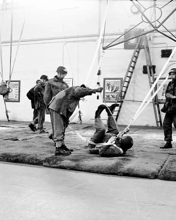 Framed Print : Parachute training in a hangar. Date: circa 1960s Framed Print : Parachute training in a hangar. Date: circa 1960s