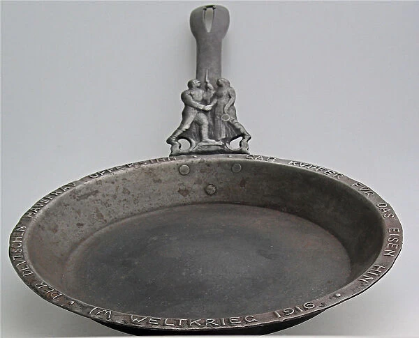 A patriotic cast iron frying pan with German soldier