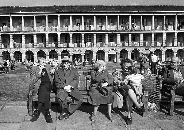 Pensioners and a child in the Piece Hall, Halifax, Yorkshire