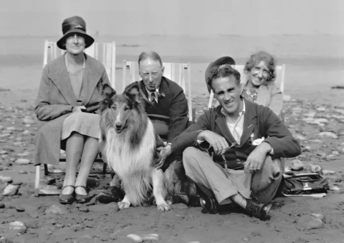 Framed Print : Four people on beach with collie dog Framed Print : Four people on beach with collie dog