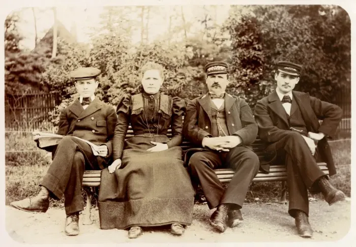 Framed Print : Four people on a bench in a garden Framed Print : Four people on a bench in a garden