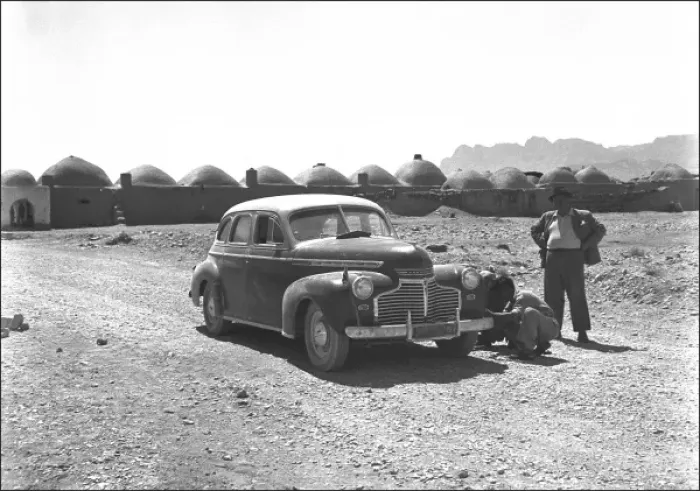Framed Print : Two people and their car in Iran Framed Print : Two people and their car in Iran