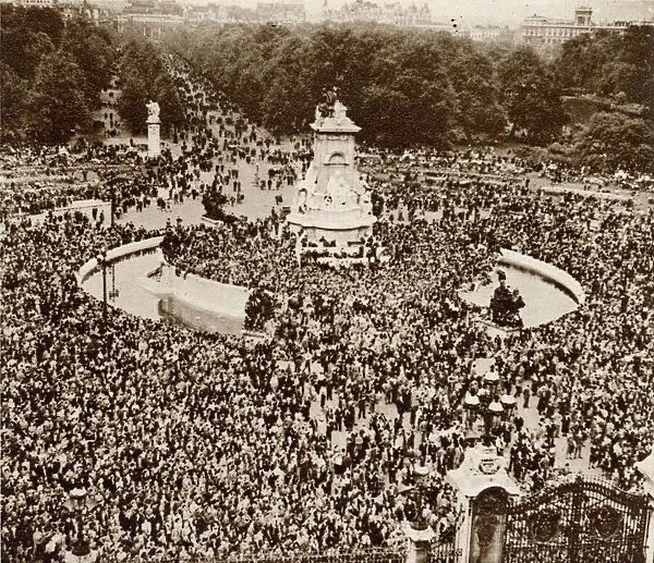 People celebrating VE Day congregating in front of Buckingham Palace where eventually