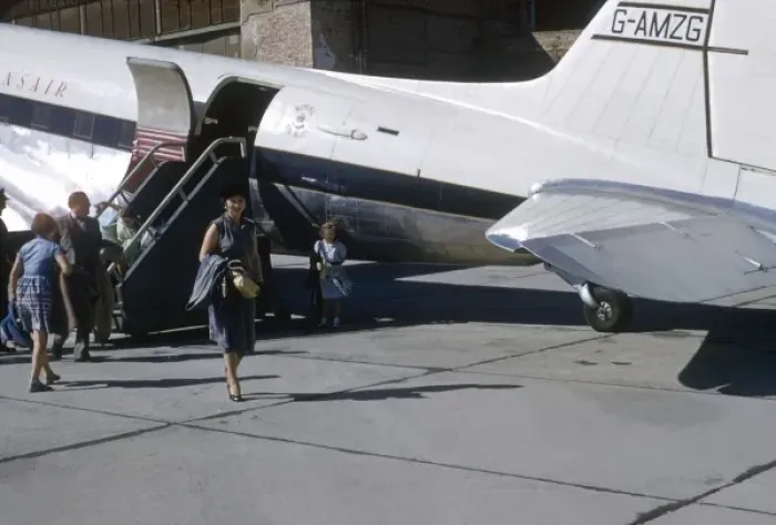 Framed Print : People disembark from a Transair aeroplane Framed Print : People disembark from a Transair aeroplane