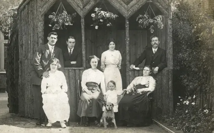 Framed Print : Eight people with a dog in a garden Framed Print : Eight people with a dog in a garden