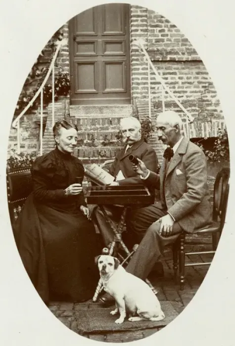 Framed Print : Three people with a dog in a garden Framed Print : Three people with a dog in a garden