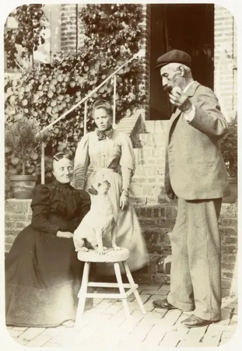 Framed Print : Three people with a dog in a garden Framed Print : Three people with a dog in a garden