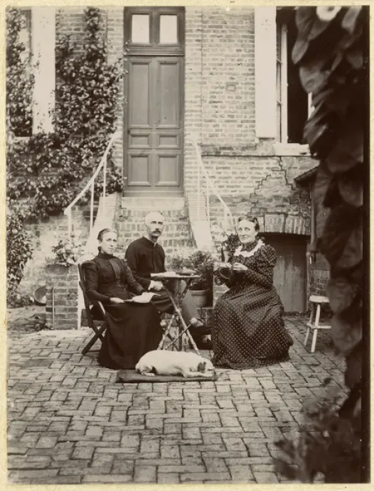 Framed Print : Three people with a dog in a garden Framed Print : Three people with a dog in a garden