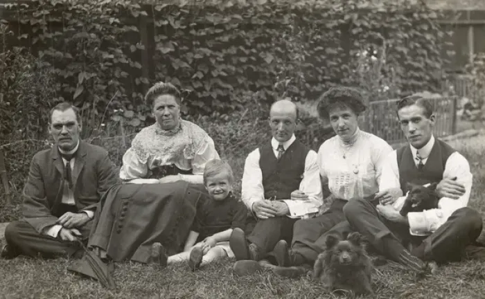 Framed Print : Six people and two dogs in a garden Framed Print : Six people and two dogs in a garden