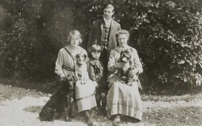 Framed Print : Four people and three dogs in a garden Framed Print : Four people and three dogs in a garden