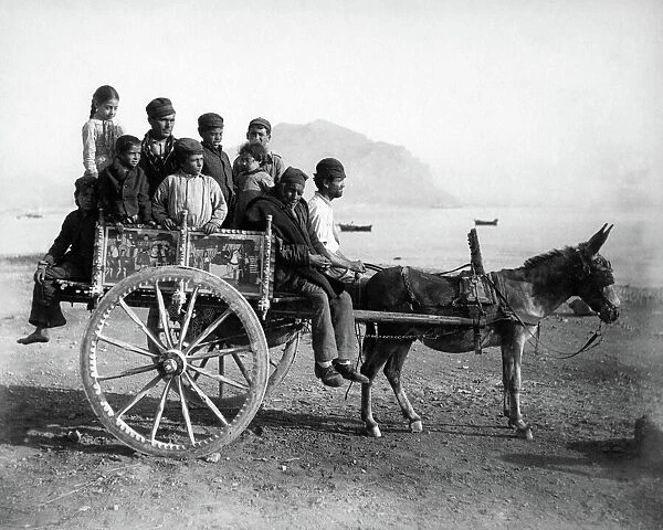 People on donkey cart, Sicily, Italy