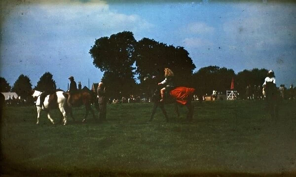 People at a fair on horseback
