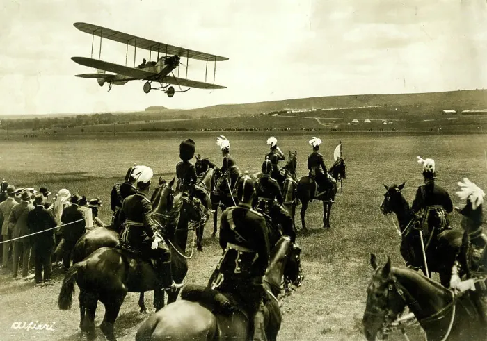 Framed Print : People in a field looking up at a biplane Framed Print : People in a field looking up at a biplane