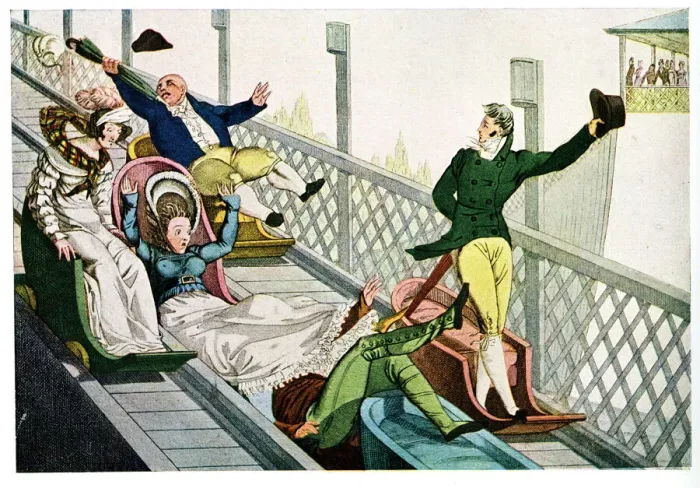 Framed Print : People at a funfair, sliding down a chute Framed Print : People at a funfair, sliding down a chute