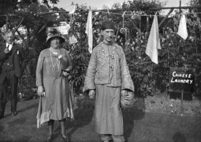 Framed Print : People in a garden with Chinese Laundry sign Framed Print : People in a garden with Chinese Laundry sign