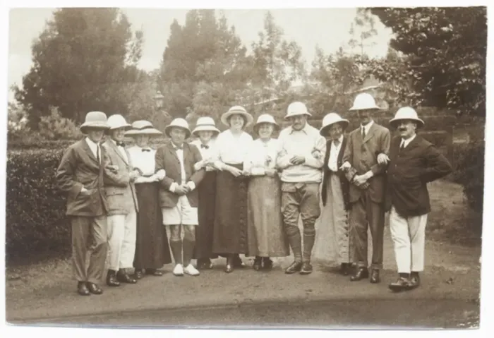 Framed Print : Eleven people in a garden wearing pith helmets Framed Print : Eleven people in a garden wearing pith helmets