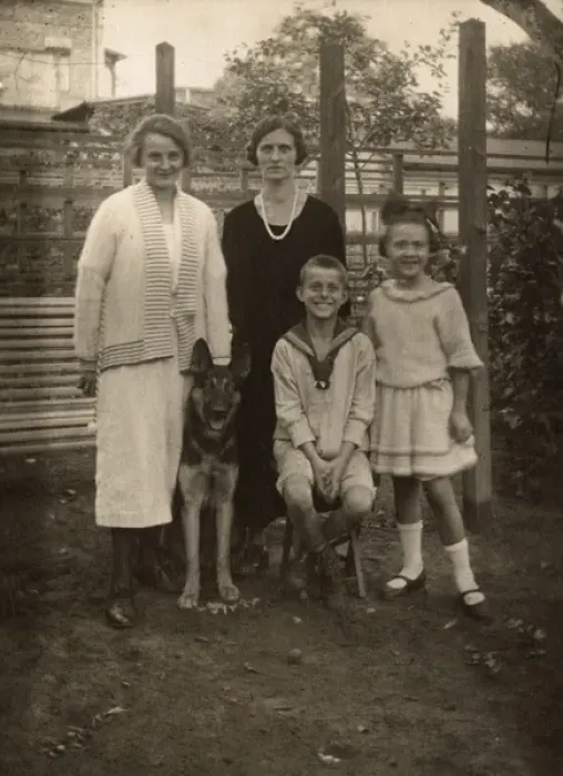 Framed Print : Four people with a German Shepherd dog in a garden Framed Print : Four people with a German Shepherd dog in a garden