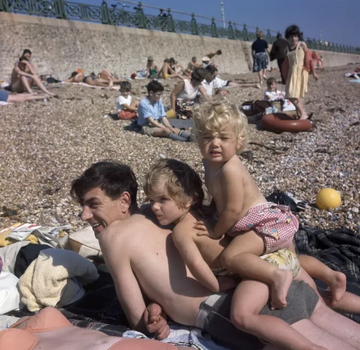Framed Print : People on holiday on a pebbly beach Framed Print : People on holiday on a pebbly beach