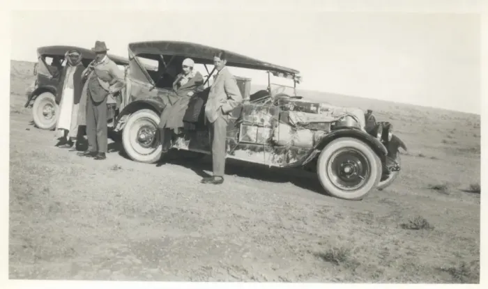 Framed Print : Four people with two loaded cars, Middle East Framed Print : Four people with two loaded cars, Middle East