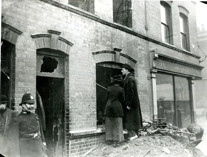 Framed Print : People looking at bullet holes after Sidney Street Siege Framed Print : People looking at bullet holes after Sidney Street Siege