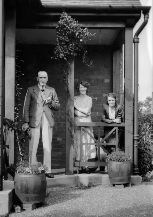 Framed Print : Three people outside a house Framed Print : Three people outside a house