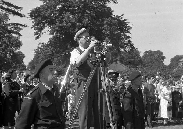 People in a park, with cine camera