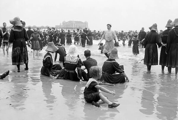 People in period bathing costumes in summer on the beach