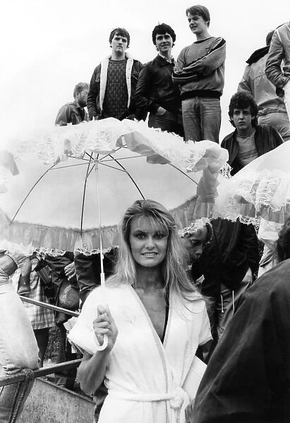 People in rain during Miss UK competition, St Ives