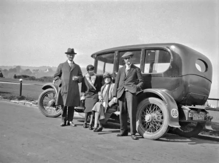 Framed Print : Four people relaxing by their car at the roadside Framed Print : Four people relaxing by their car at the roadside