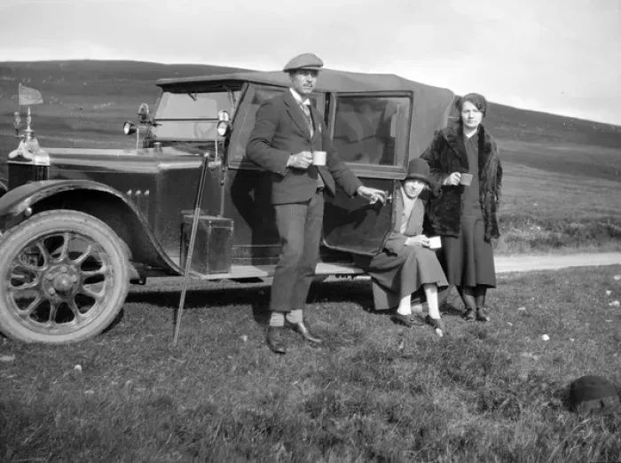 Framed Print : Three people resting at the side of their car Framed Print : Three people resting at the side of their car