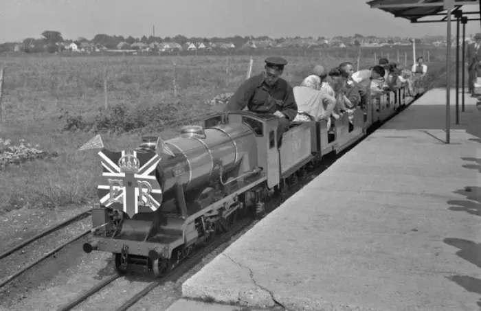 Framed Print : People riding on a miniature steam train Framed Print : People riding on a miniature steam train