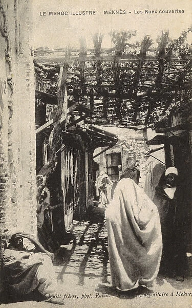 People in a shaded street, Meknes, Morocco