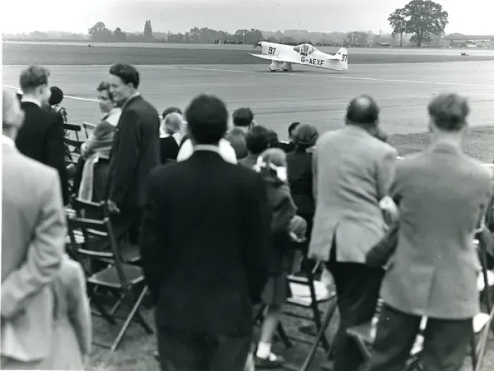 Framed Print : Percival E2 Mew Gull, G-AEXF, taxies past spectators at ? Framed Print : Percival E2 Mew Gull, G-AEXF, taxies past spectators at ?