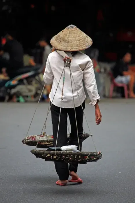 Framed Print : Person carrying traditional baskets in Hanoi, Vietnam Framed Print : Person carrying traditional baskets in Hanoi, Vietnam