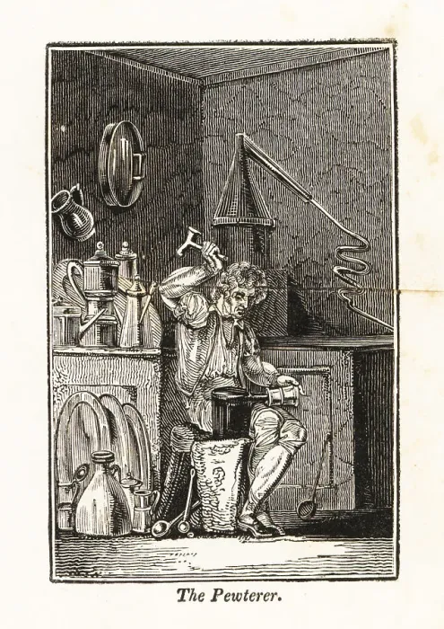 Framed Print : Pewterer hammering a pewter mug on an anvil in his workshop Framed Print : Pewterer hammering a pewter mug on an anvil in his workshop
