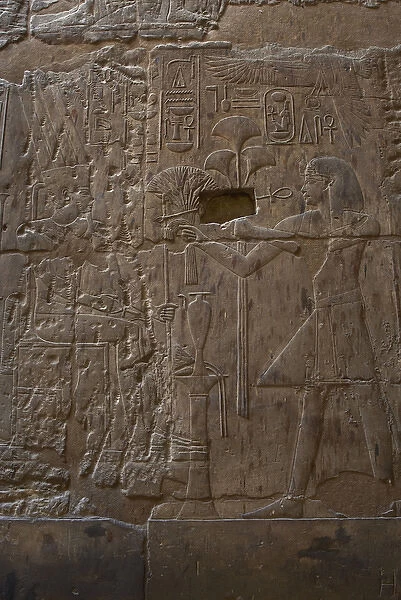 Pharaoh Amenhotep III offering to the god Amun lotus flower