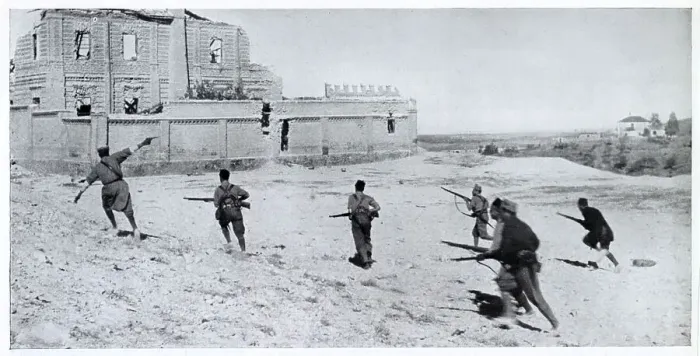 Framed Print : Photograph showing a Nationalist infantry unit, led by their officer (on left, with pistol), running across open ground towards a ruined house during the Spanish Civil War, 1936. This photograph was probably taken on the frontline south of Madrid Framed Print : Photograph showing a Nationalist infantry unit, led by their officer (on left, with pistol), running across open ground towards a ruined house during the Spanish Civil War, 1936. This photograph was probably taken on the frontline south of Madrid