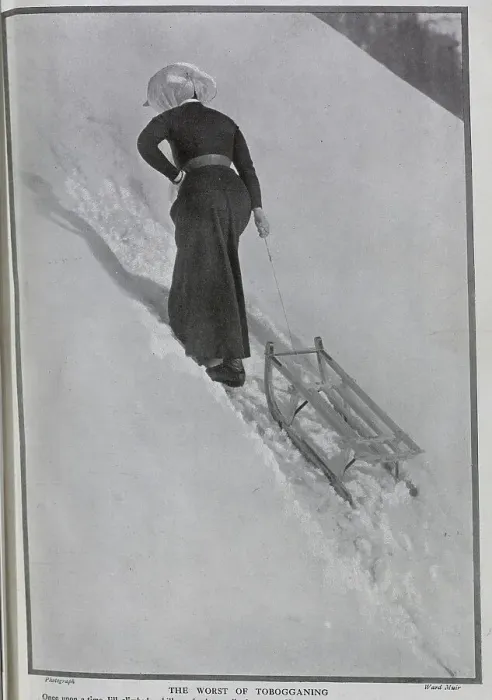 Framed Print : Photograph of woman climbing snowy hill, pulling toboggan behind her, at St Beatenberg, Lake Thun, Switzerland, by Ward Muir. Captioned, Jill - to Date! and The Worst of Tobogganing'. Date: 1910 Framed Print : Photograph of woman climbing snowy hill, pulling toboggan behind her, at St Beatenberg, Lake Thun, Switzerland, by Ward Muir. Captioned, Jill - to Date! and The Worst of Tobogganing'. Date: 1910