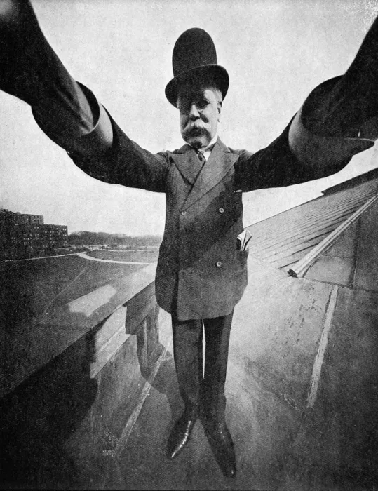 Framed Print : Photographer holding a Sky-scraper camera on the roof of a Framed Print : Photographer holding a Sky-scraper camera on the roof of a