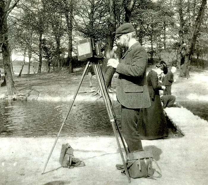 Framed Print : Photographer in a park with wooden camera on tripod Framed Print : Photographer in a park with wooden camera on tripod