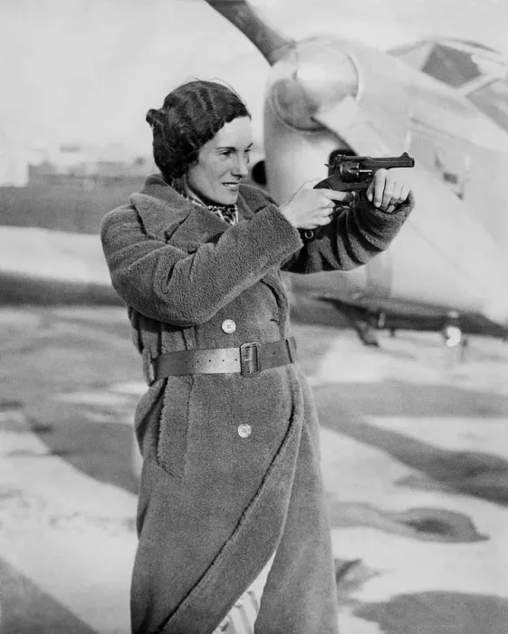 Framed Print : A Picture of Jean Batten with a Hand-Gun Framed Print : A Picture of Jean Batten with a Hand-Gun