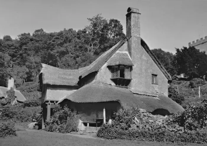 Framed Print : A picturesque house with a thatched roof Framed Print : A picturesque house with a thatched roof