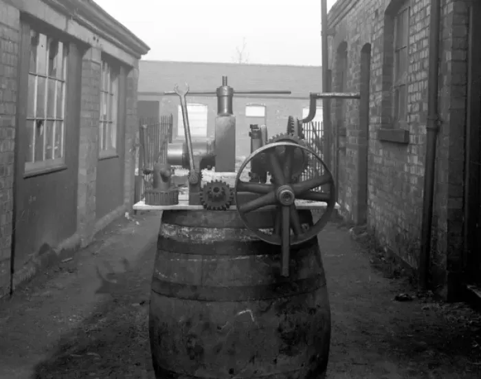 Framed Print : Pipe screwing machine for hat factory
