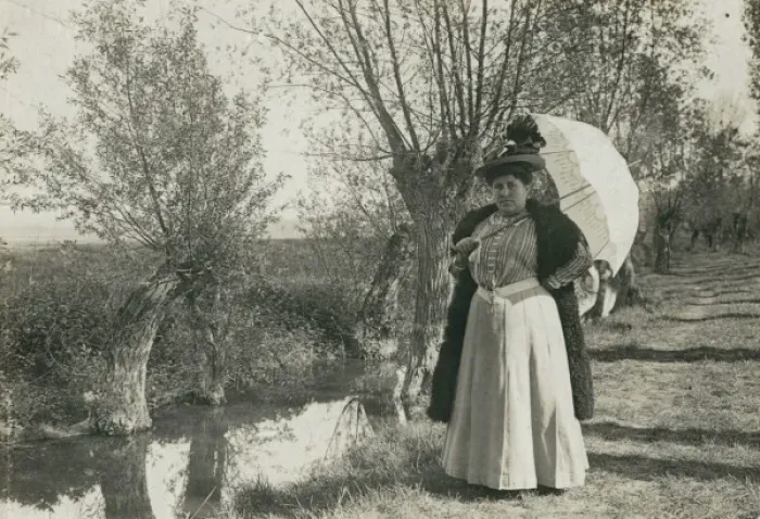 Framed Print : Plump woman with parasol by a stream Framed Print : Plump woman with parasol by a stream